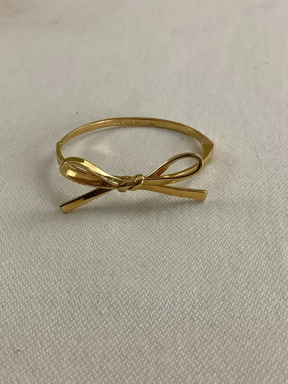 kate spade gold-tone bow hinged bangle bracelet